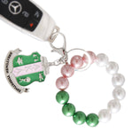 Load image into Gallery viewer, AKA Pink Green Pearl Shield Keychain
